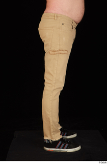 Spencer black sneakers brown trousers dressed leg lower body 0007.jpg